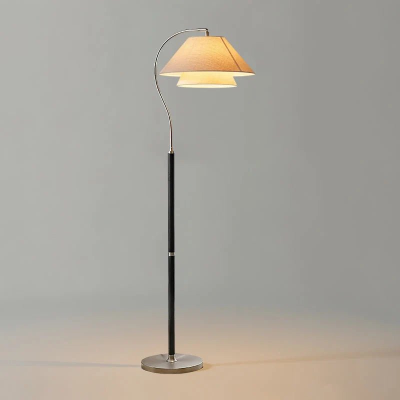Modern Scandinavian floor lamp featuring layered fabric shades and an elegant arched frame, perfect for stylish home decor and ambient lighting. 9