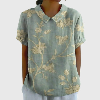 Floral blouse for women featuring a relaxed fit and lightweight fabric, perfect for summer casual wear in plus sizes. 0