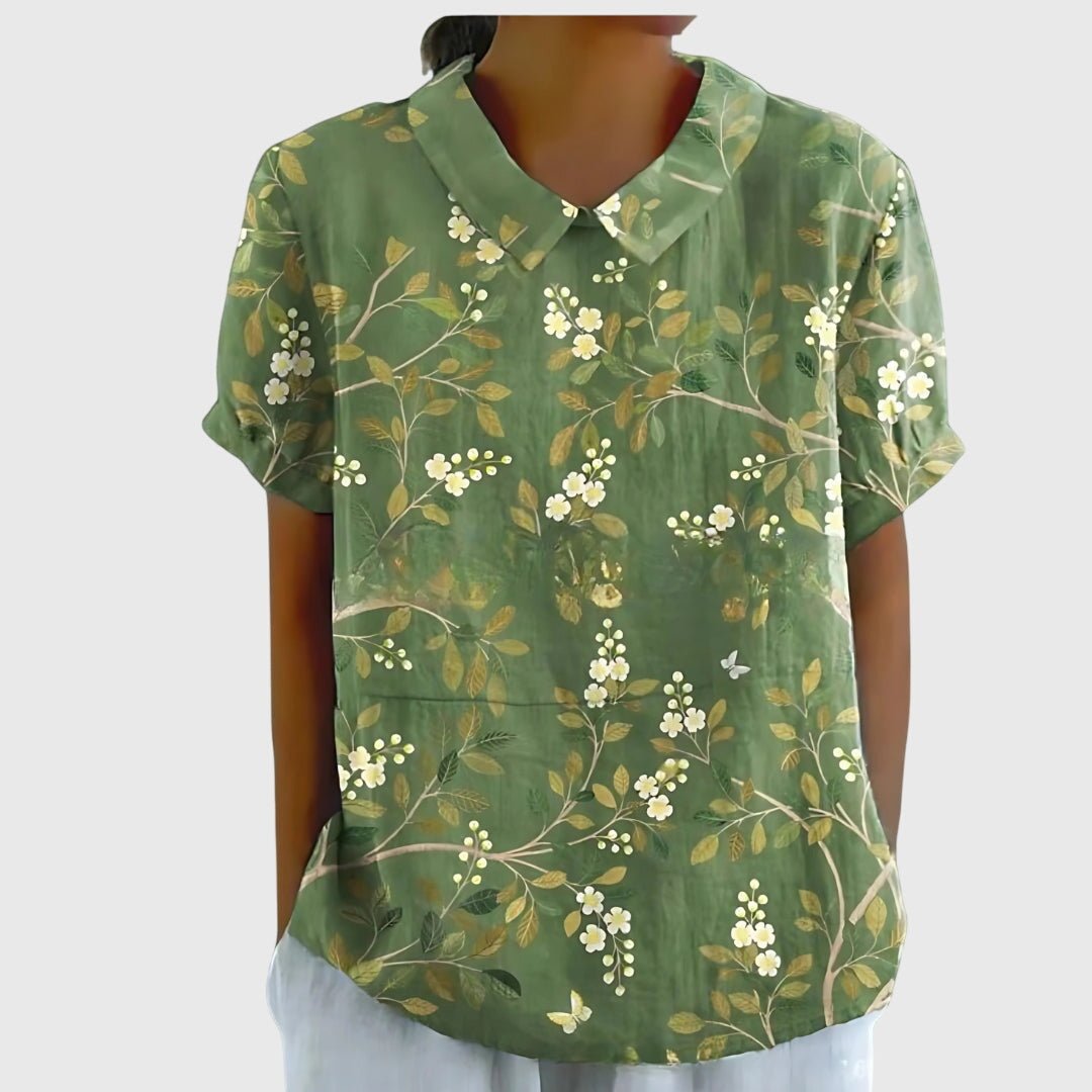 Floral blouse for women featuring a relaxed fit and lightweight fabric, perfect for summer casual wear in plus sizes. 11