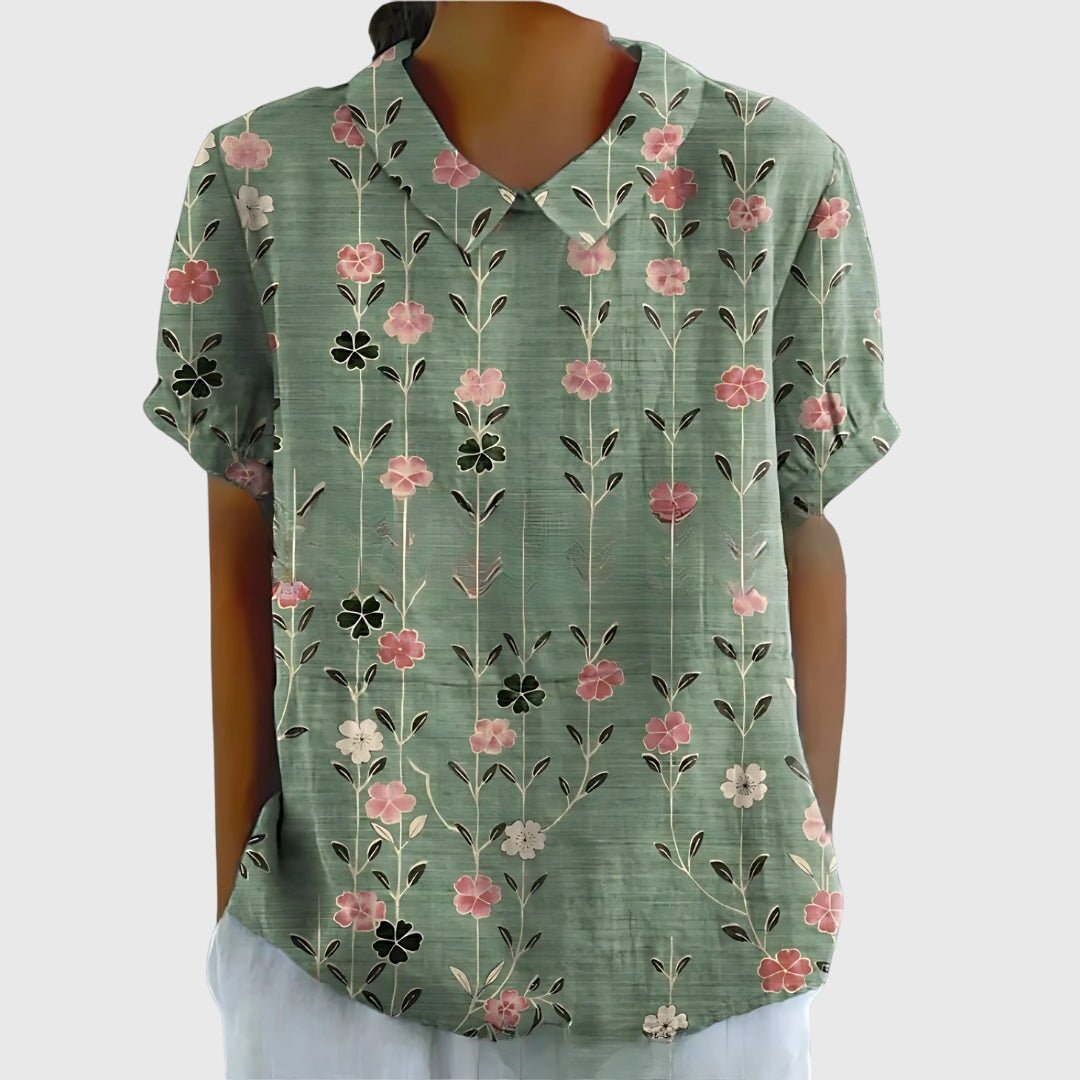 Floral blouse for women featuring a relaxed fit and lightweight fabric, perfect for summer casual wear in plus sizes. 1