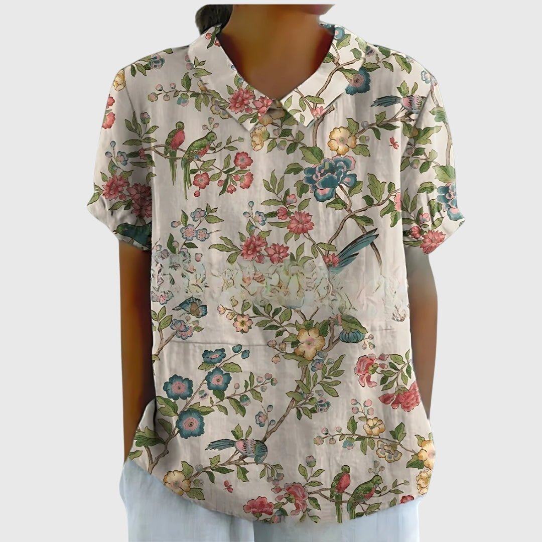 Floral blouse for women featuring a relaxed fit and lightweight fabric, perfect for summer casual wear in plus sizes. 6
