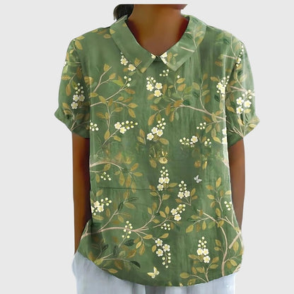 Lightweight floral blouse for women featuring a relaxed fit, perfect for summer, adorned with feminine prints. 11
