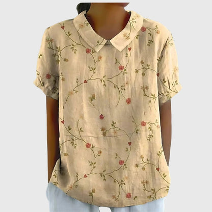 Lightweight floral blouse for women featuring a relaxed fit, perfect for summer, adorned with feminine prints. 2
