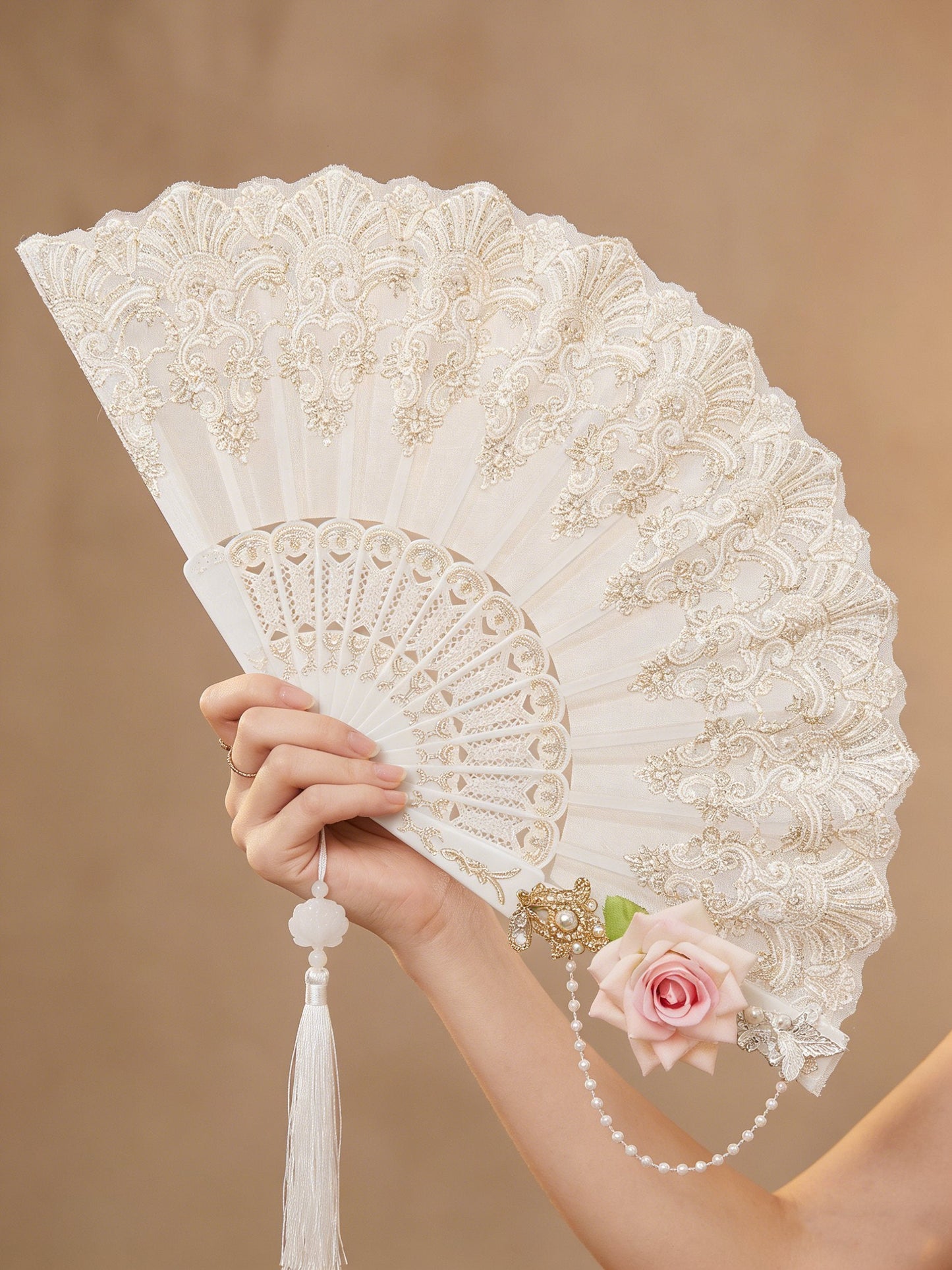 Floral folding fan with lace design, perfect for weddings and parties, showcasing an elegant and lightweight accessory for stylish occasions. 0