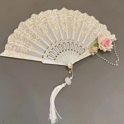 Floral folding fan with lace design, perfect for weddings and parties, showcasing an elegant and lightweight accessory for stylish occasions. 1