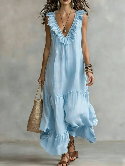 Floral maxi dress featuring ruffle details and an irregular hem, perfect for casual vacation style in lightweight fabric. 3