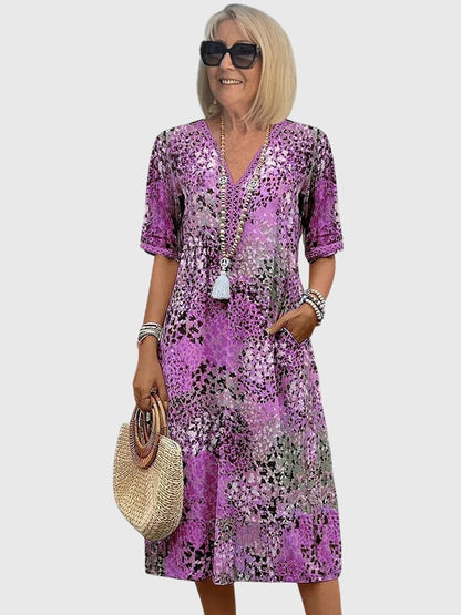Floral midi dress featuring a chic design and lightweight fabric, perfect for elegant women's fashion. 4