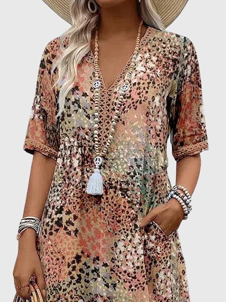 Floral midi dress featuring a chic design and lightweight fabric, perfect for elegant women's fashion. 5