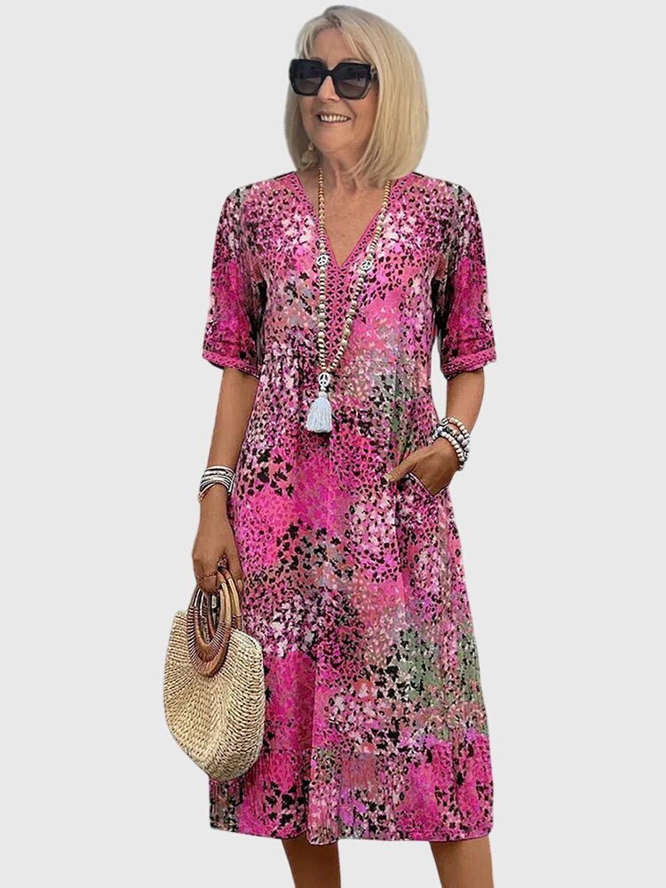 Floral midi dress featuring a chic design and lightweight fabric, perfect for elegant women's fashion. 3