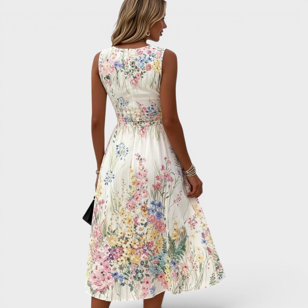 Floral midi dress featuring a vibrant watercolor print and cinched waist, perfect for summer weddings and special occasions. 3