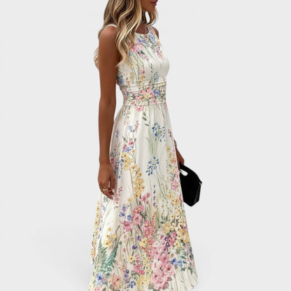 Floral midi dress featuring a vibrant watercolor print and cinched waist, perfect for summer weddings and special occasions. 2