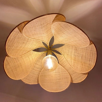 Flower-shaped hanging lamp featuring a modern design with a fabric and metal finish, emitting warm light, ideal for enhancing the ambiance in living rooms or bedrooms. 0