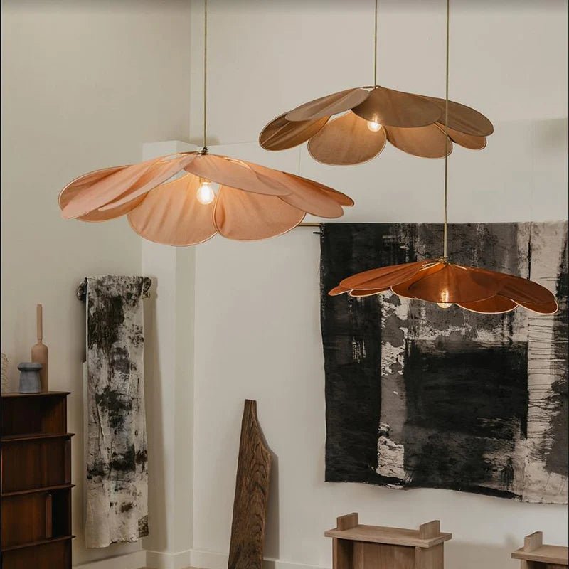 Flower-shaped hanging lamp featuring a modern design with a fabric and metal finish, emitting warm light, ideal for enhancing the ambiance in living rooms or bedrooms. 1
