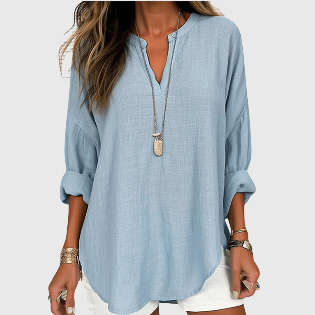 Flowy beach shirt featuring an elegant design, long sleeves, and breathable fabric, perfect for stylish summer outings and beach days. 0