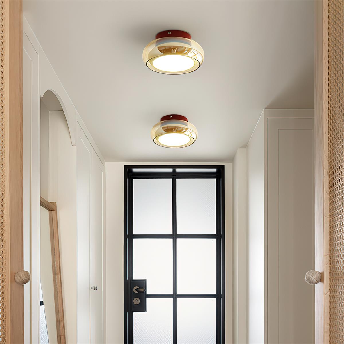 Flush mount ceiling light featuring a sleek modern metal design, integrated LED technology, and a round glass shade, perfect for enhancing the ambiance of bedrooms and living 4