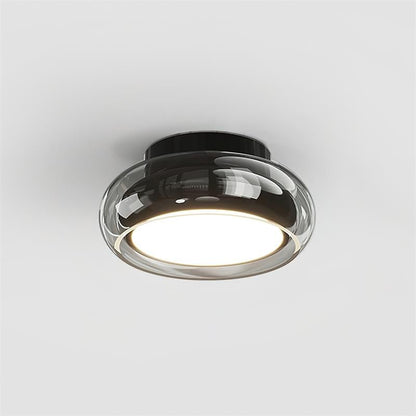 Flush mount ceiling light featuring a sleek modern metal design, integrated LED technology, and a round glass shade, perfect for enhancing the ambiance of bedrooms and living 6