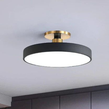 Flush mount ceiling light featuring soft LED illumination, designed in a minimalist Nordic style with a sleek acrylic finish, perfect for modern home decor. 4