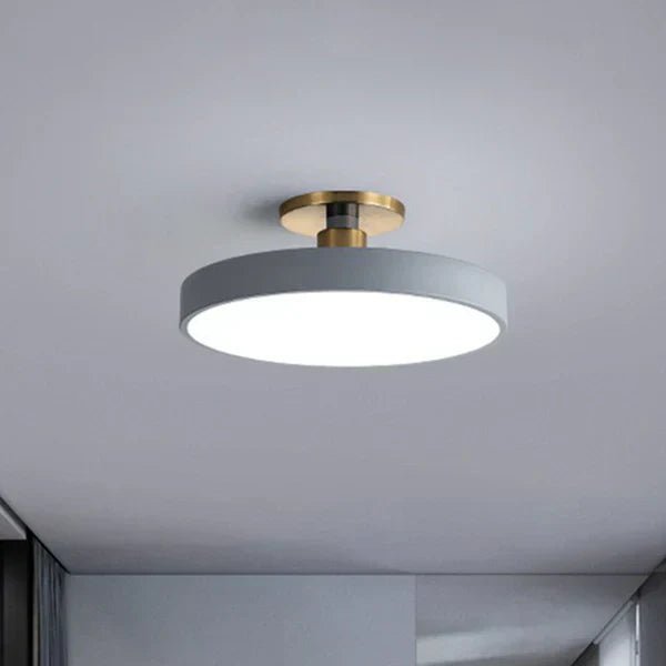 Flush mount ceiling light featuring soft LED illumination, designed in a minimalist Nordic style with a sleek acrylic finish, perfect for modern home decor. 5