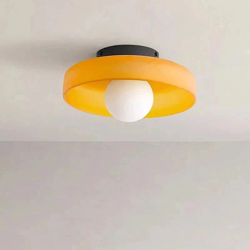 Flush mount ceiling light featuring a sleek Scandinavian glass design, emitting soft, warm lighting, perfect for enhancing modern interior spaces. 2