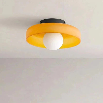 Flush mount ceiling light featuring a sleek Scandinavian glass design, emitting soft, warm lighting, perfect for enhancing modern interior spaces. 2