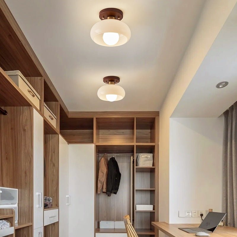 Flush mount ceiling light featuring a warm glow, elegant wooden accent, and a Bauhaus style opal glass shade, perfect for enhancing the ambiance of bedrooms 3