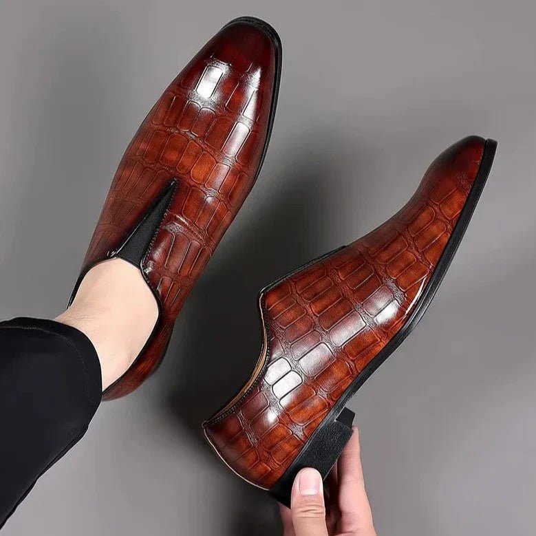 Genuine leather loafers with a cushioned insole and lustrous finish, perfect for formal occasions and everyday wear. 1
