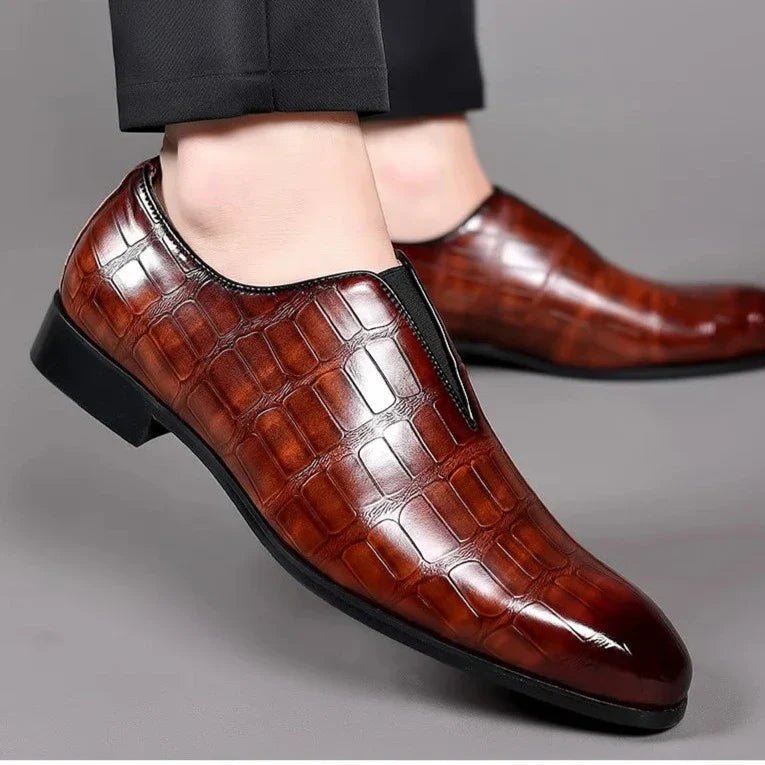 Genuine leather loafers with a cushioned insole and lustrous finish, perfect for formal occasions and everyday wear. 2
