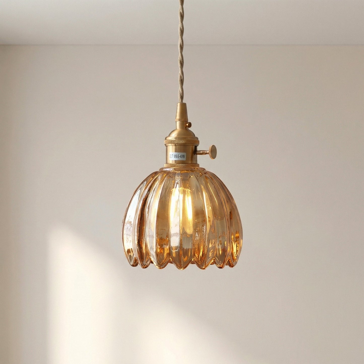 Glass pendant lamp featuring a minimalist Japanese design, adjustable height, perfect for modern kitchen lighting. 7