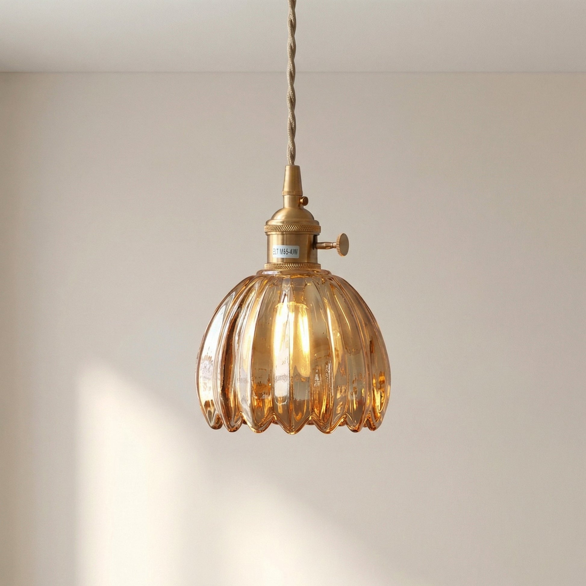 Glass pendant lamp featuring a minimalist Japanese design, adjustable height, perfect for modern kitchen lighting. 7