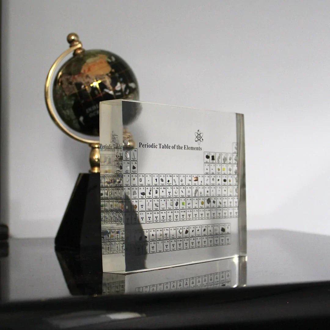 Glass periodic table display featuring real element samples, ideal for educational chemistry decor in classrooms and study spaces. 0
