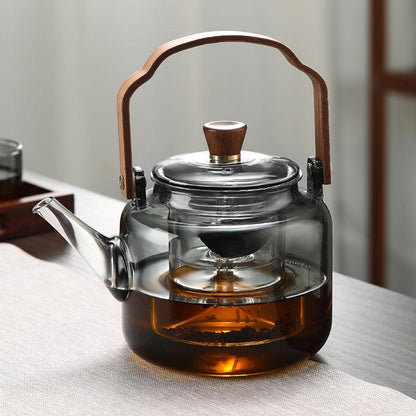 Elegant smoked glass teapot with infuser and wooden lid, perfect for brewing 1.2L of tea, combining style and functionality. 4