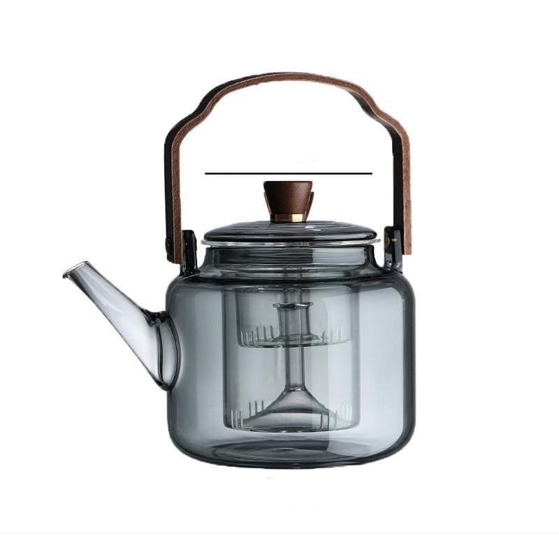 Elegant smoked glass teapot with infuser and wooden lid, perfect for brewing 1.2L of tea, combining style and functionality. 6