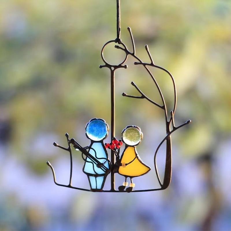 Handcrafted glazed metallic sun catcher featuring multi-colored glass that creates vibrant rainbow reflections, perfect for enhancing any window or indoor space. 0
