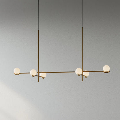 Globe pendant light featuring a modern white glass shade and sleek metal design, adjustable height for kitchen island or dining room illumination. 10