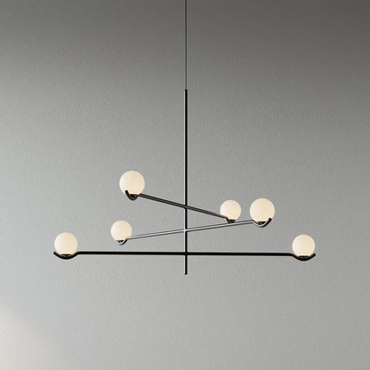 Globe pendant light featuring a modern white glass shade and sleek metal design, adjustable height for kitchen island or dining room illumination. 11