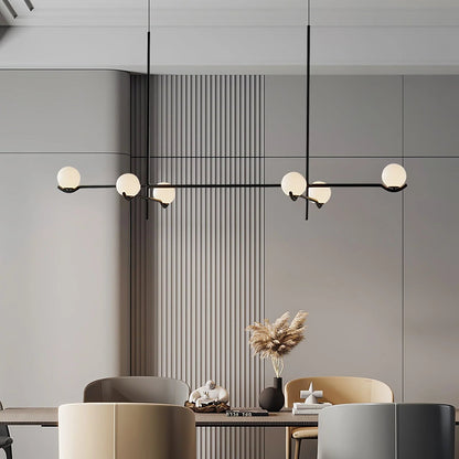 Globe pendant light featuring a modern white glass shade and sleek metal design, adjustable height for kitchen island or dining room illumination. 7
