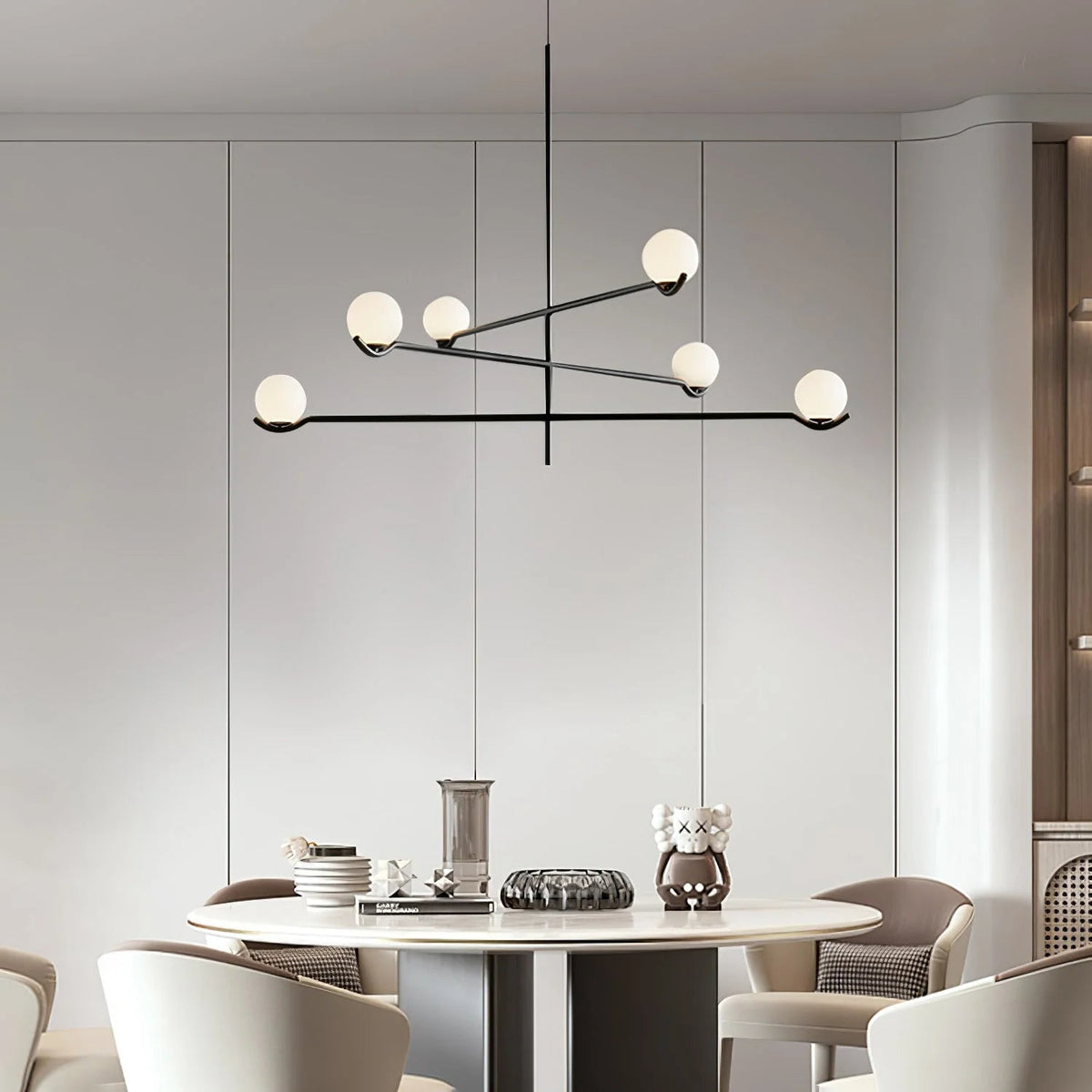 Globe pendant light featuring a modern white glass shade and sleek metal design, adjustable height for kitchen island or dining room illumination. 3