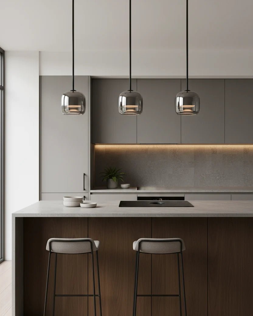 Modern globe pendant light featuring a smoky glass shade and sleek black metal finish, perfect for stylish kitchen lighting with integrated LED technology. 3