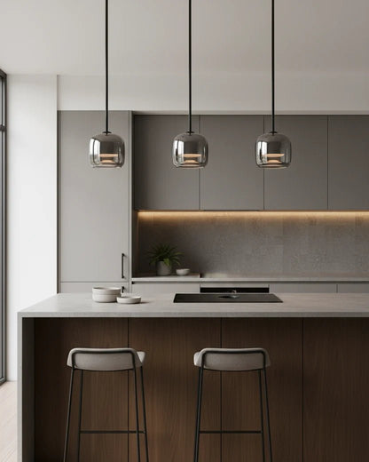 Modern globe pendant light featuring a smoky glass shade and sleek black metal finish, perfect for stylish kitchen lighting with integrated LED technology. 3