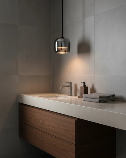 Modern globe pendant light featuring a smoky glass shade and sleek black metal finish, perfect for stylish kitchen lighting with integrated LED technology. 5