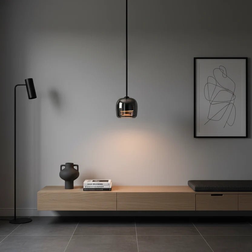 Modern globe pendant light featuring a smoky glass shade and sleek black metal finish, perfect for stylish kitchen lighting with integrated LED technology. 2