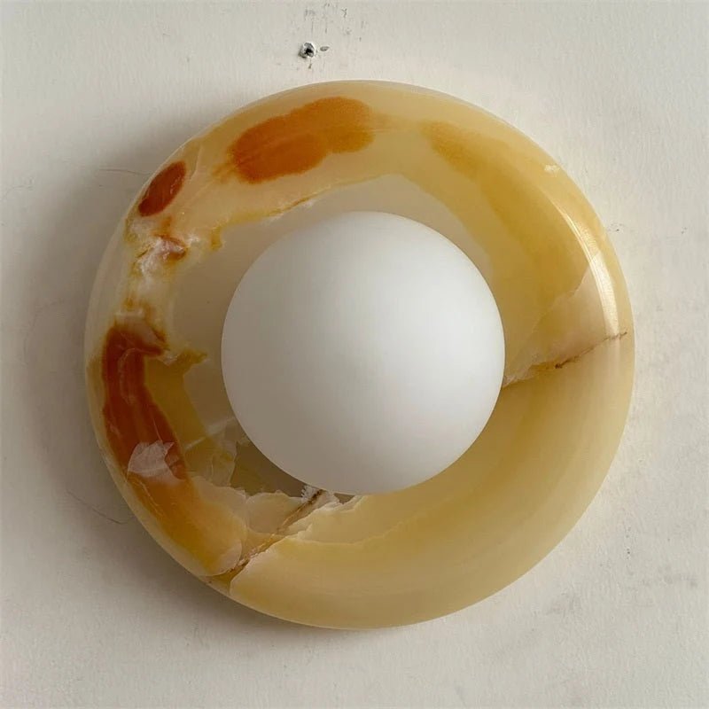 Globe Wall Light featuring a natural onyx backplate, designed as a compact ambient sconce for modern interior decor. 5
