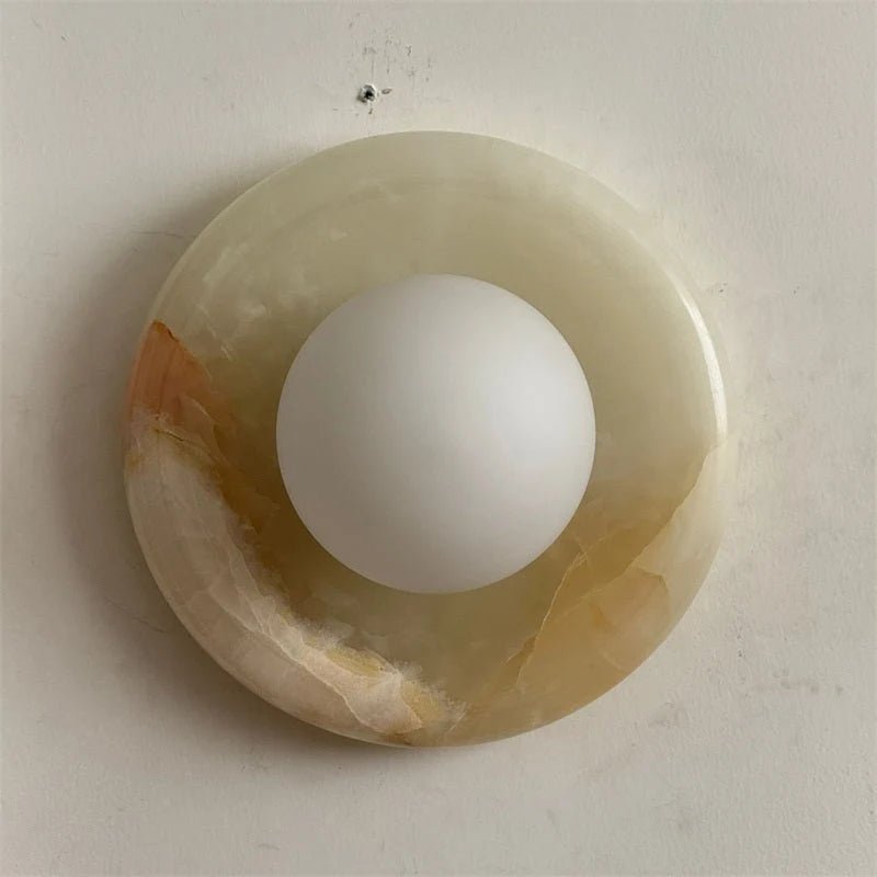 Globe Wall Light featuring a natural onyx backplate, designed as a compact ambient sconce for modern interior decor. 6