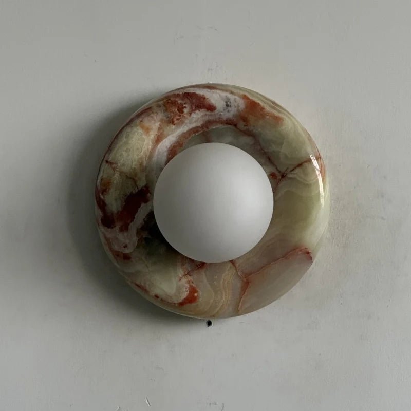 Globe Wall Light featuring a natural onyx backplate, designed as a compact ambient sconce for modern interior decor. 10