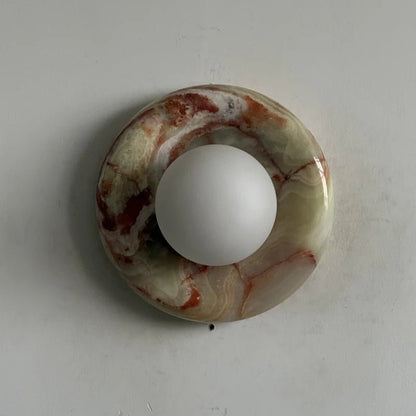 Globe Wall Light featuring a natural onyx backplate, designed as a compact ambient sconce for modern interior decor. 10