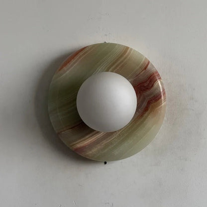 Globe Wall Light featuring a natural onyx backplate, designed as a compact ambient sconce for modern interior decor. 34