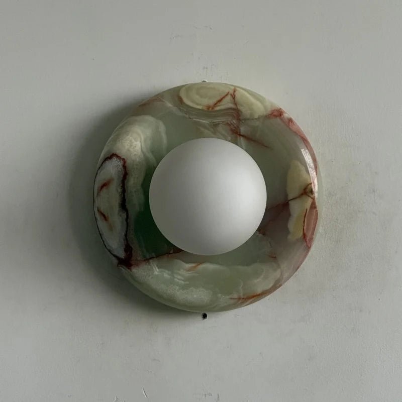 Globe Wall Light featuring a natural onyx backplate, designed as a compact ambient sconce for modern interior decor. 20