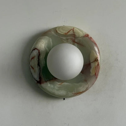 Globe Wall Light featuring a natural onyx backplate, designed as a compact ambient sconce for modern interior decor. 20