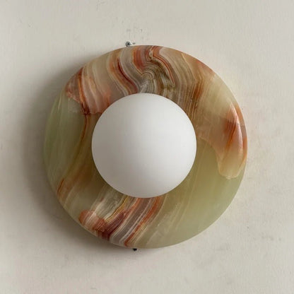Globe Wall Light featuring a natural onyx backplate, designed as a compact ambient sconce for modern interior decor. 16