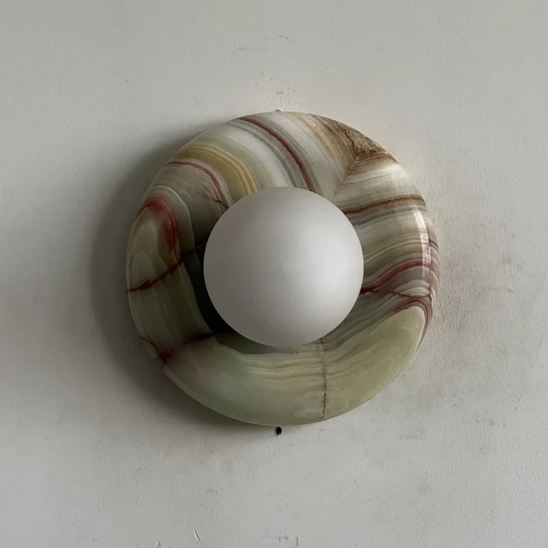 Globe Wall Light featuring a natural onyx backplate, designed as a compact ambient sconce for modern interior decor. 33